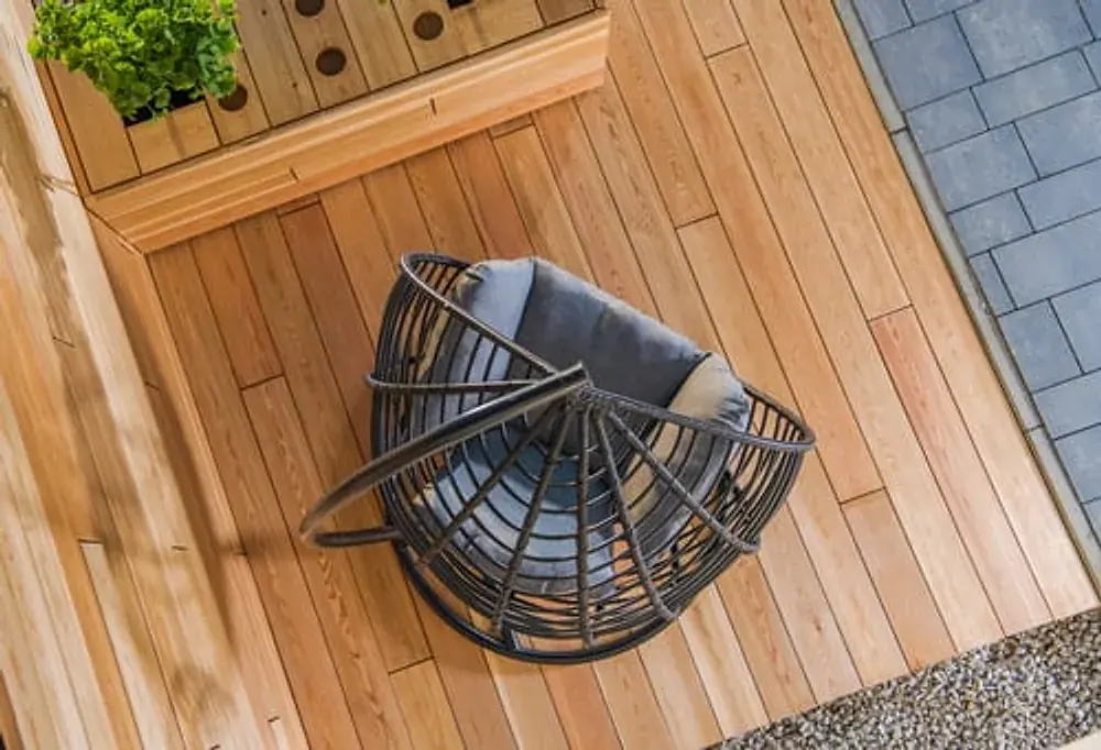 Newly built wood deck viewed from above with outdoor seating