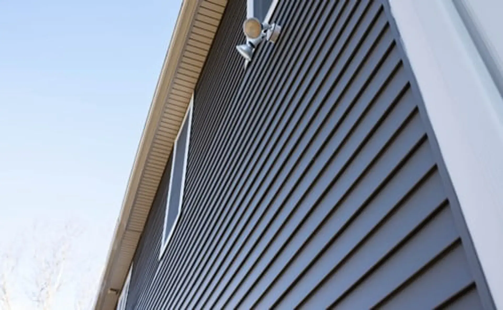 Clean vinyl siding and rooflines on a Connecticut home exterior