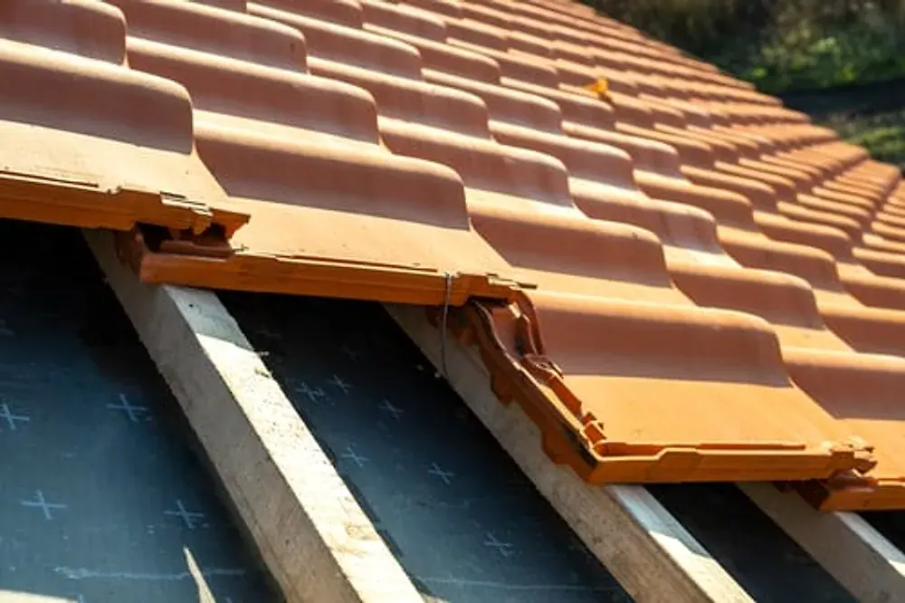 Close-up of roof tiles and battens during a targeted roof repair