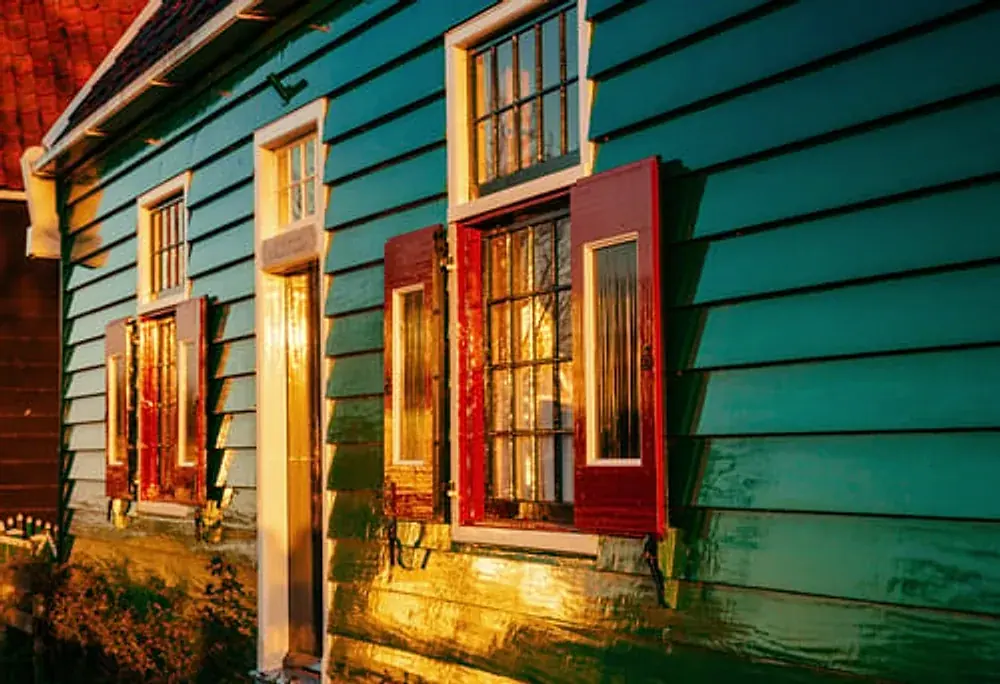 Painted clapboard siding on a home exterior undergoing repair